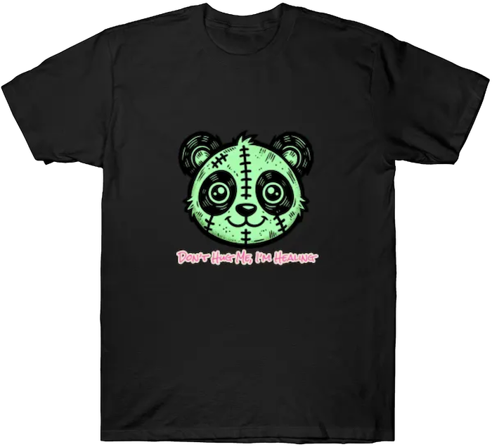 A stitched green panda plush with wide eyes and the phrase “Don’t Hug Me I’m Healing.”